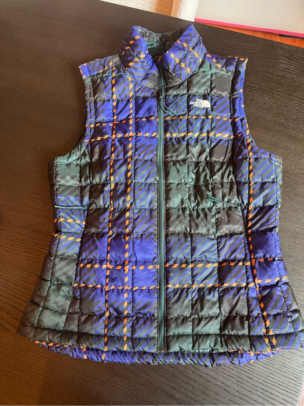 The North Face Blue, Black & Orange Plaid Quilted Vest